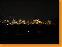 Melbourne v noci z parku a z lehu